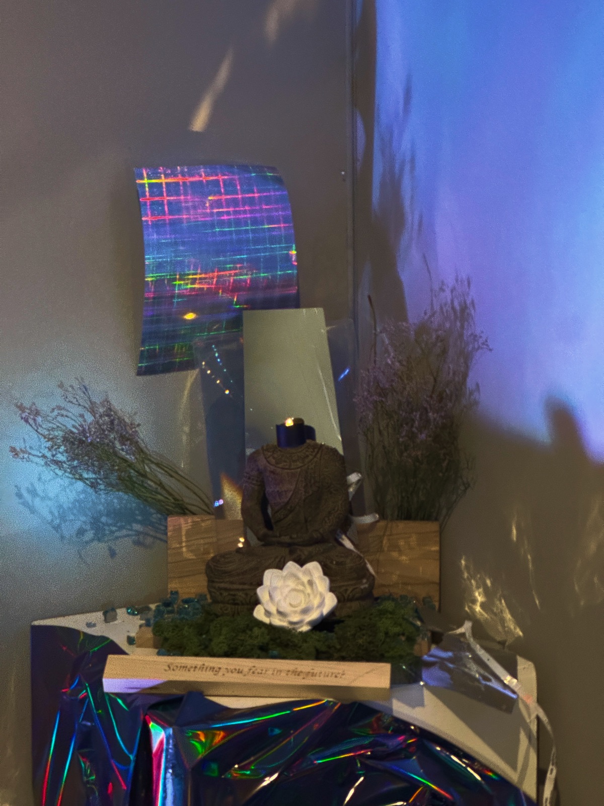 Bloom exhibition — physical bodhi altar with holographic sheet and lotus