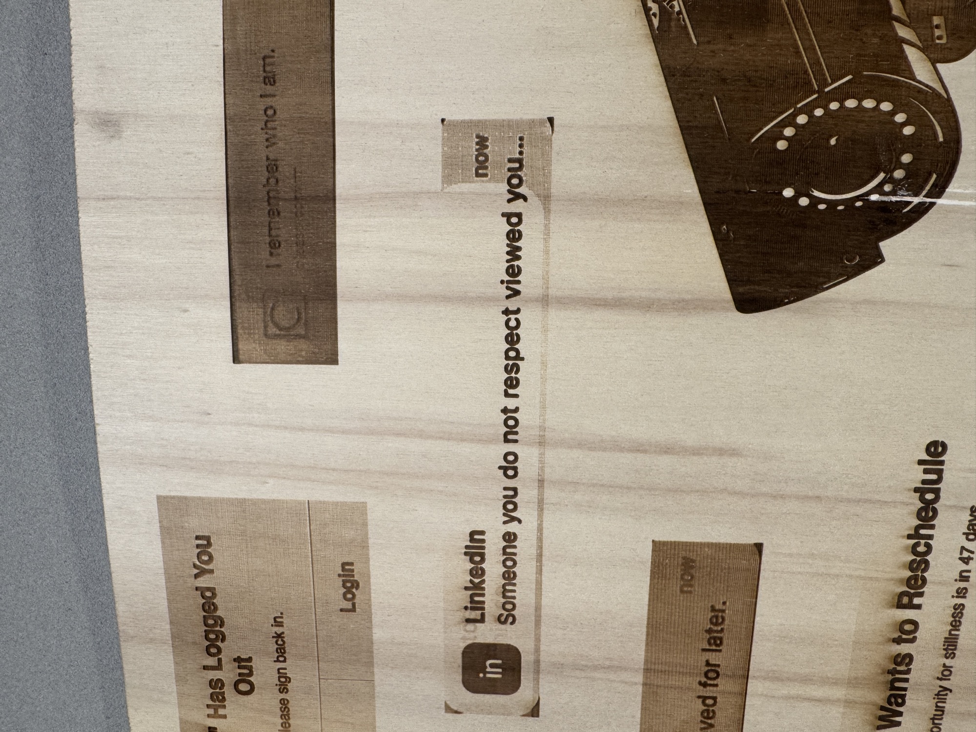 Bloom exhibition — engraved wood panel of notification fragments