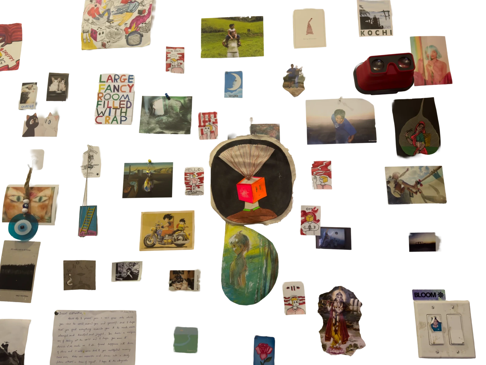 The wall above Sid's desk: postcards, drawings, photographs, a letter, and a cube-headed figure in the middle