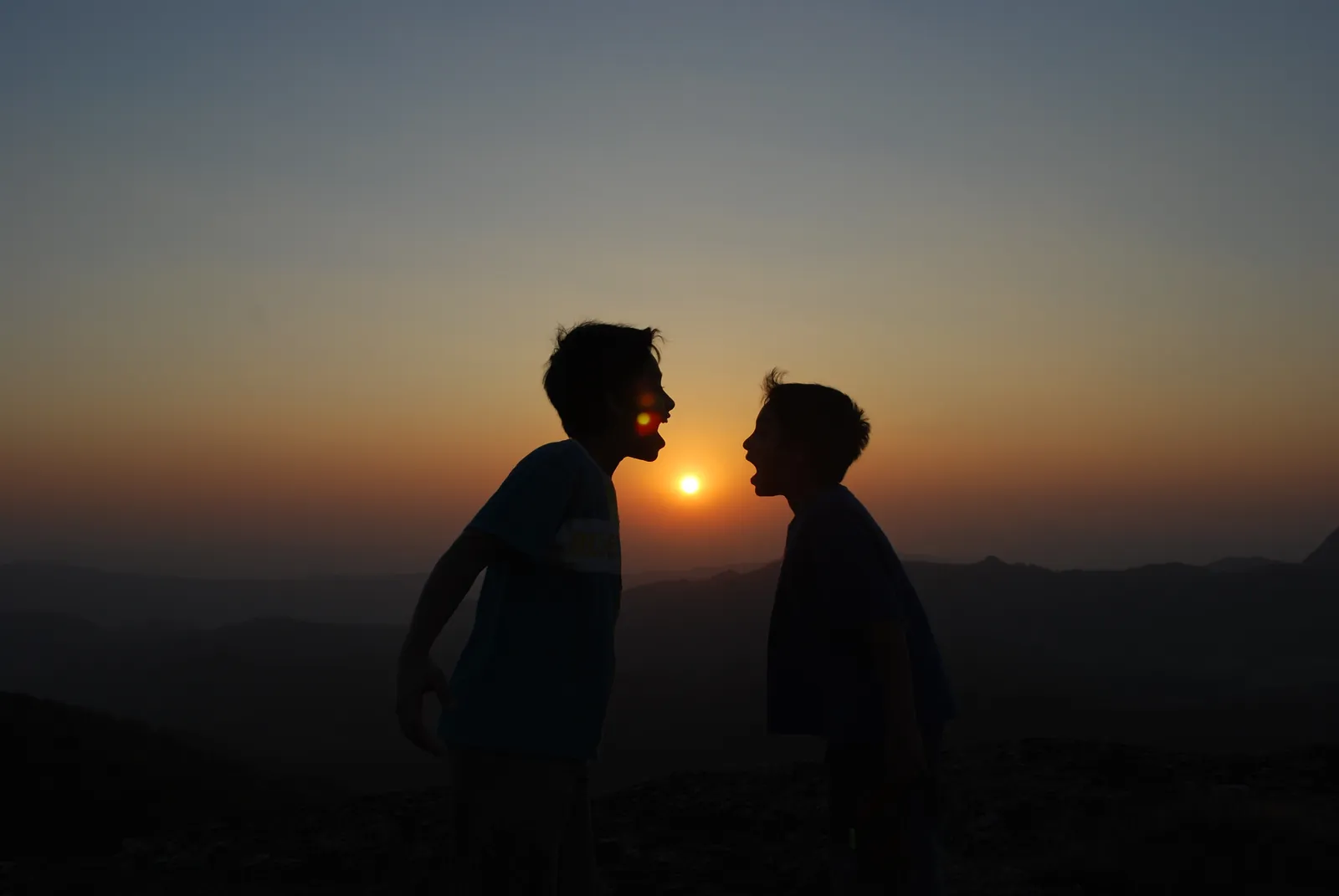 Two silhouettes at sunset